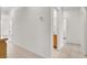 Bright hallway featuring tile flooring and neutral walls leading to various rooms in the home at 209 Prairie Creek St, Henderson, NV 89012