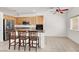 Open kitchen with granite countertops, stainless steel appliances, and an island bar at 209 Prairie Creek St, Henderson, NV 89012