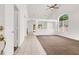 Spacious living room with tile and carpet, a ceiling fan, and ample natural light at 209 Prairie Creek St, Henderson, NV 89012