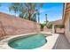 Relaxing backyard pool with mature trees providing shade and a covered patio area with bright, desert sunshine at 209 Prairie Creek St, Henderson, NV 89012