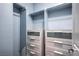 Well-organized walk-in closet featuring custom shelving, drawers, and ample storage space at 2189 De Narvik Dr, Henderson, NV 89044