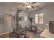 Well-equipped exercise room with various machines, mirrors, and natural light at 2189 De Narvik Dr, Henderson, NV 89044
