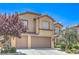 Charming two-story home with a three-car garage and well-manicured front yard at 2189 De Narvik Dr, Henderson, NV 89044