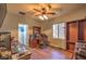 Functional home office with built-in desk, a window view, and laminate wood flooring at 2189 De Narvik Dr, Henderson, NV 89044