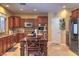 Bright kitchen with stainless steel appliances, granite countertops, and breakfast bar at 2189 De Narvik Dr, Henderson, NV 89044