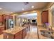 Modern kitchen with stainless steel appliances, granite countertops, and an island at 2189 De Narvik Dr, Henderson, NV 89044