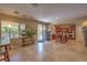 Open-concept kitchen features an island, stainless steel appliances, and adjacent dining area at 2189 De Narvik Dr, Henderson, NV 89044