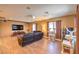 A spacious living room features a projector and screen, hardwood floors, and comfortable seating at 2189 De Narvik Dr, Henderson, NV 89044