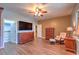 Comfortable main bedroom with wood floors, seating, and access to a walk-in closet at 2189 De Narvik Dr, Henderson, NV 89044
