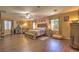 Spacious main bedroom features hardwood floors, ceiling fan, and a comfortable seating area at 2189 De Narvik Dr, Henderson, NV 89044
