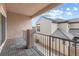 Exterior view from the covered balcony overlooking neighboring rooftops and the sky at 2231 Desert Prairie St, Las Vegas, NV 89135