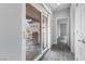 Hallway leading to the outdoor balcony with large glass sliding doors at 2231 Desert Prairie St, Las Vegas, NV 89135