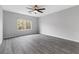 Large bedroom with expansive windows and wood-look flooring at 2231 Desert Prairie St, Las Vegas, NV 89135