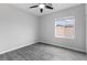 Neutral bedroom with a ceiling fan and window at 2231 Desert Prairie St, Las Vegas, NV 89135