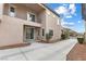 Side view of home highlighting exterior siding, windows, balcony, and long driveway at 2231 Desert Prairie St, Las Vegas, NV 89135