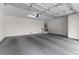 Clean, spacious garage with white walls, ample room for parking, and access door at 2231 Desert Prairie St, Las Vegas, NV 89135