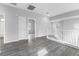 Bright hallway features wood flooring and white bannister overlooking an open floorplan at 2231 Desert Prairie St, Las Vegas, NV 89135