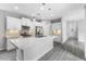 Modern kitchen featuring white cabinets, quartz countertops, and stainless steel appliances at 2231 Desert Prairie St, Las Vegas, NV 89135