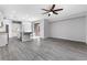 Open-concept living area that seamlessly connects the kitchen and living room with hardwood flooring throughout at 2231 Desert Prairie St, Las Vegas, NV 89135