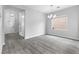Open-concept living area showcasing wood-look floors and natural light at 2231 Desert Prairie St, Las Vegas, NV 89135
