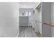 Bright walk-in closet with wood-style flooring, multiple shelves, and plenty of space for hanging clothes at 2231 Desert Prairie St, Las Vegas, NV 89135