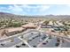 Aerial view of community buildings, roads, parking, tennis courts and desert landscaped grounds at 2326 Garnet Star St, Henderson, NV 89044