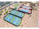 Aerial view of multi-colored tennis and bocce ball courts, adding recreational amenities to the community at 2326 Garnet Star St, Henderson, NV 89044