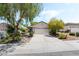 Charming single-story home featuring mature landscaping and a two-car garage at 2326 Garnet Star St, Henderson, NV 89044