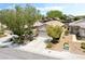 Single-story home featuring a well-manicured front yard with desert landscaping at 2326 Garnet Star St, Henderson, NV 89044