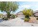 Attractive single-story home with desert landscaping, a two-car garage, and a welcoming driveway at 2326 Garnet Star St, Henderson, NV 89044