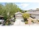 Charming single-story home with a well-maintained front yard and a two-car garage at 2326 Garnet Star St, Henderson, NV 89044