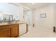 Bright kitchen featuring wood cabinets, white appliances, and a breakfast bar at 2326 Garnet Star St, Henderson, NV 89044