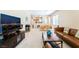 Inviting living room with plush seating, media center, and abundant natural light at 2326 Garnet Star St, Henderson, NV 89044