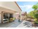 Relaxing covered patio with table and chairs, perfect for outdoor dining at 2326 Garnet Star St, Henderson, NV 89044