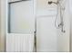 Shower stall featuring sliding glass doors, a chrome shower head and white shower surround at 2326 Garnet Star St, Henderson, NV 89044