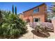 Backyard features a patio, lush greenery, and vibrant landscaping at 2373 Rue Royale St, Henderson, NV 89044