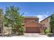 Attractive exterior view of a two-story home with a well-kept front yard and a brick driveway at 2373 Rue Royale St, Henderson, NV 89044