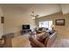 Bright living room with tile floor, neutral walls, and large windows offering natural light at 2373 Rue Royale St, Henderson, NV 89044