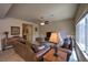 Inviting living room with tile floors and a large window, perfect for relaxing and entertaining at 2373 Rue Royale St, Henderson, NV 89044