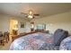 The spacious main bedroom features a ceiling fan, carpet and a desk/workspace in the corner at 2373 Rue Royale St, Henderson, NV 89044