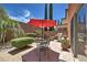 Back patio with pavers and seating offers a tranquil space to unwind outdoors at 2373 Rue Royale St, Henderson, NV 89044