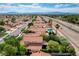 Expansive aerial view of a Las Vegas neighborhood with tidy homes, mature landscaping, and mountain views at 2412 Muirfield Ave, Henderson, NV 89074