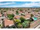 An aerial view of a Las Vegas neighborhood showcasing the neatly maintained homes and community pool at 2412 Muirfield Ave, Henderson, NV 89074