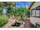Relaxing backyard with koi pond, trees, side yard and grass at 2412 Muirfield Ave, Henderson, NV 89074
