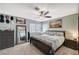 Bright bedroom with a large bed, dresser, and mirror, offering a comfortable and stylish retreat at 2412 Muirfield Ave, Henderson, NV 89074