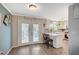 Bright kitchen with bar seating open to the backyard through french doors at 2412 Muirfield Ave, Henderson, NV 89074
