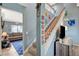 Staircase leading to upper level, with a view to living room at 2412 Muirfield Ave, Henderson, NV 89074