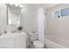 Cozy bathroom with white vanity, toilet, and shower-tub combination at 2432 Spanish Ct, Las Vegas, NV 89108