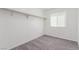A serene bedroom offers comfortable carpet, a window for natural light, and a serene atmosphere at 2432 Spanish Ct, Las Vegas, NV 89108