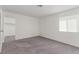 Well-lit bedroom features carpet, a window, and ample closet space at 2432 Spanish Ct, Las Vegas, NV 89108